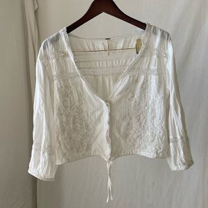 Free people size Medium, super cute white top.